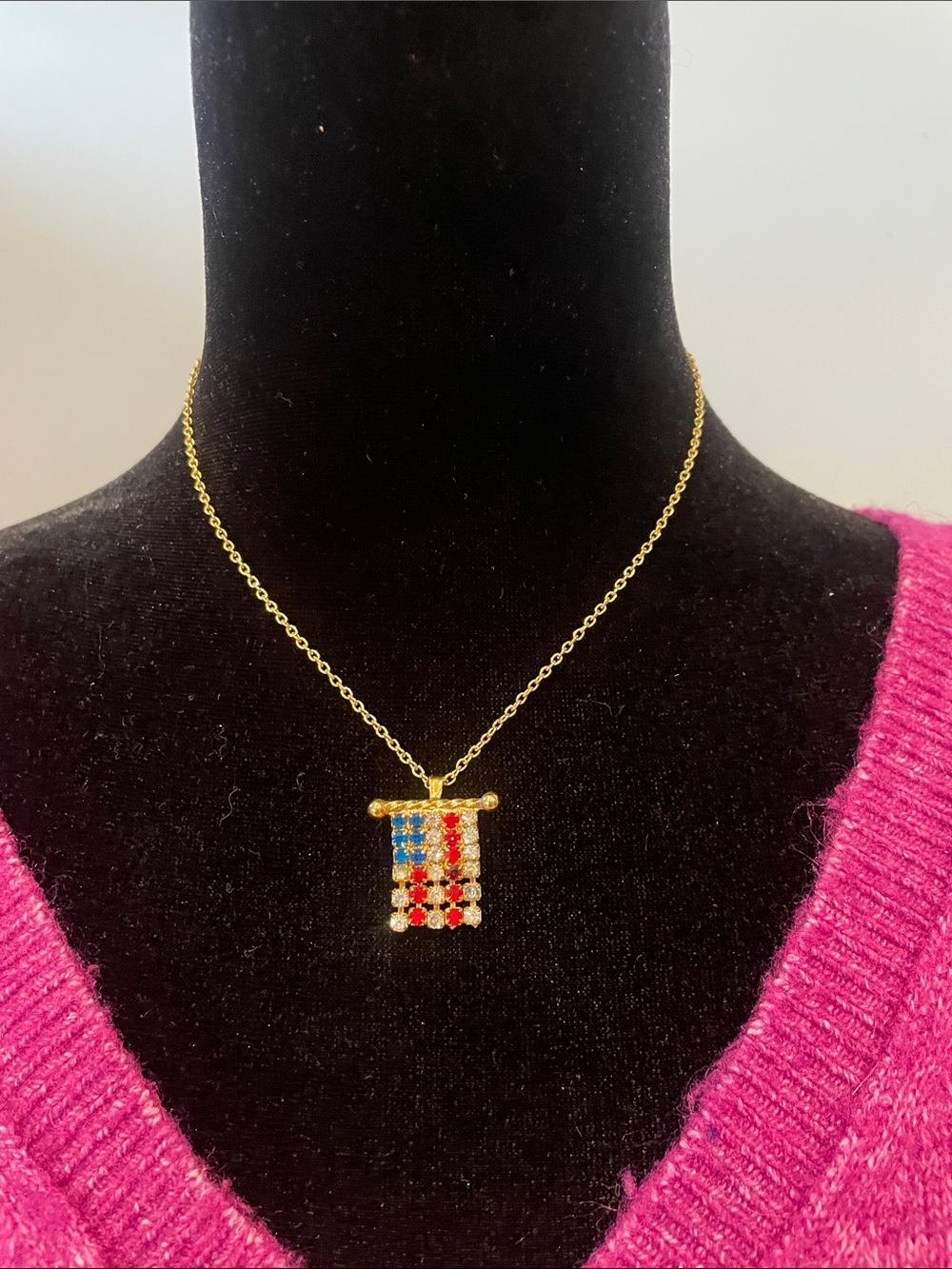 American flag pendant on gold chain